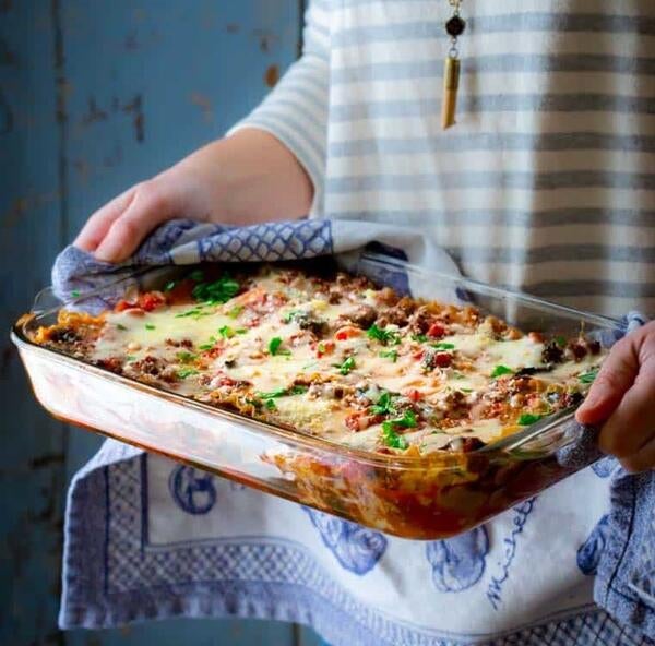 Lasagna being given to neighbor